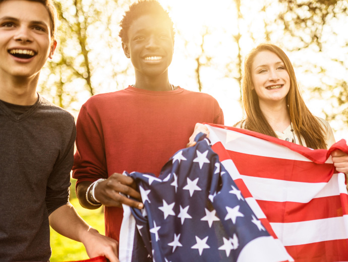 students with aAmerican flag